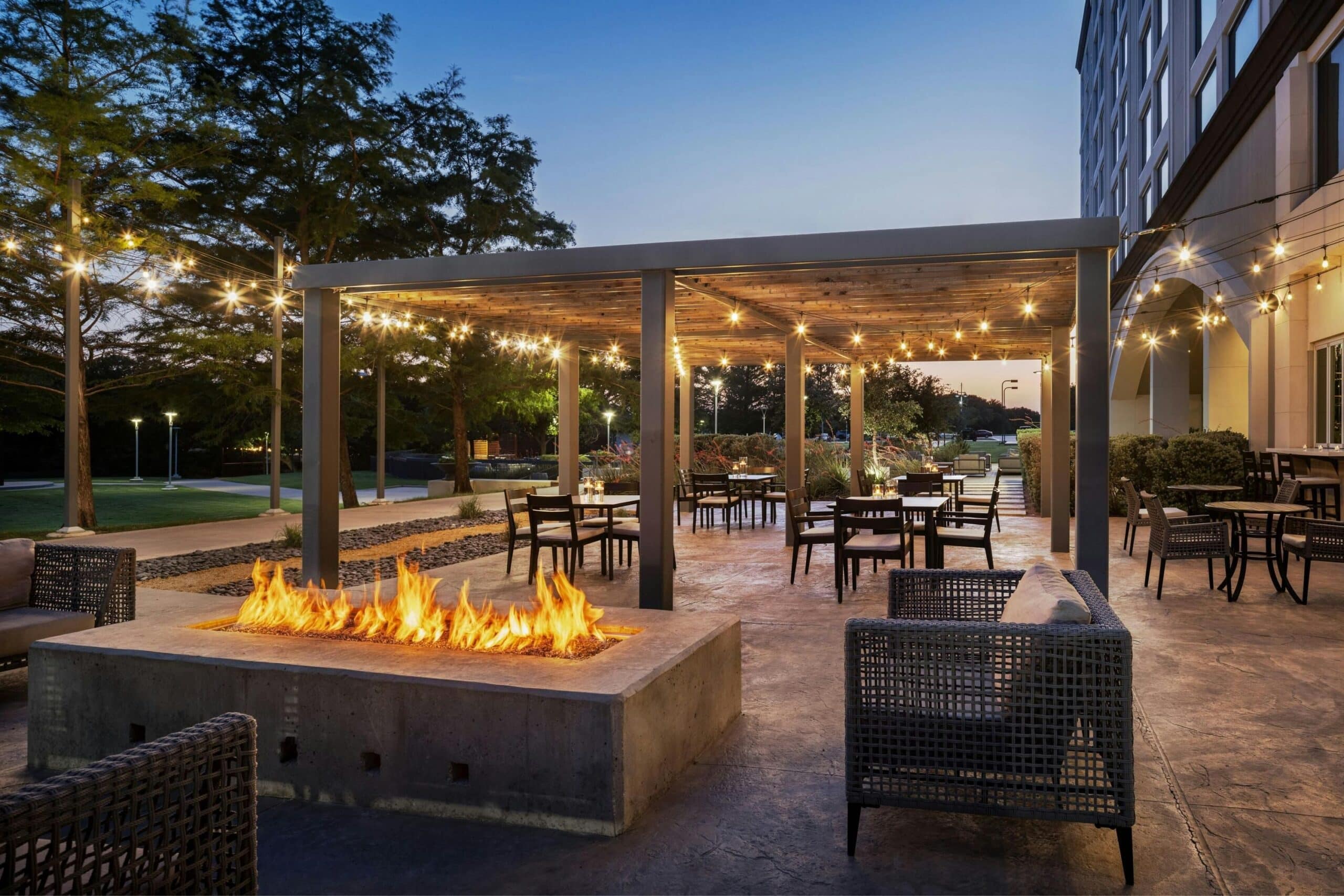 Outdoor terrace with fire pit and pergola seating