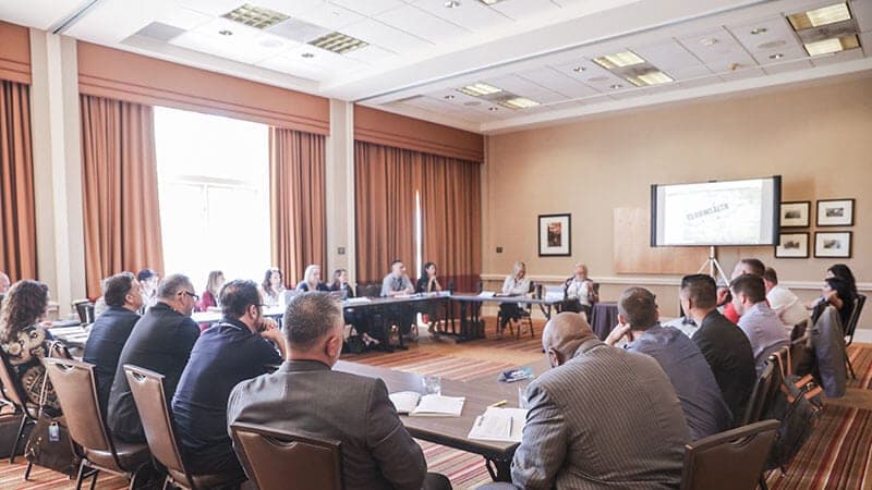Agents around the table at a Club Wealth coaching mastermind