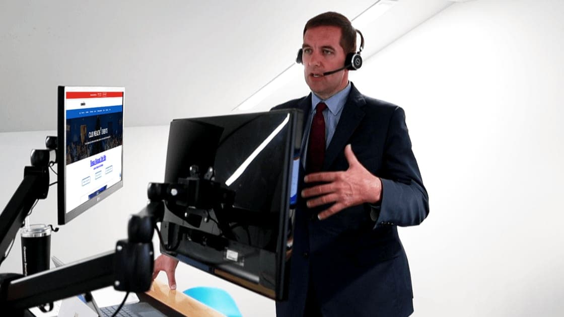 A Club Wealth strategist on a headset running a virtual strategy session